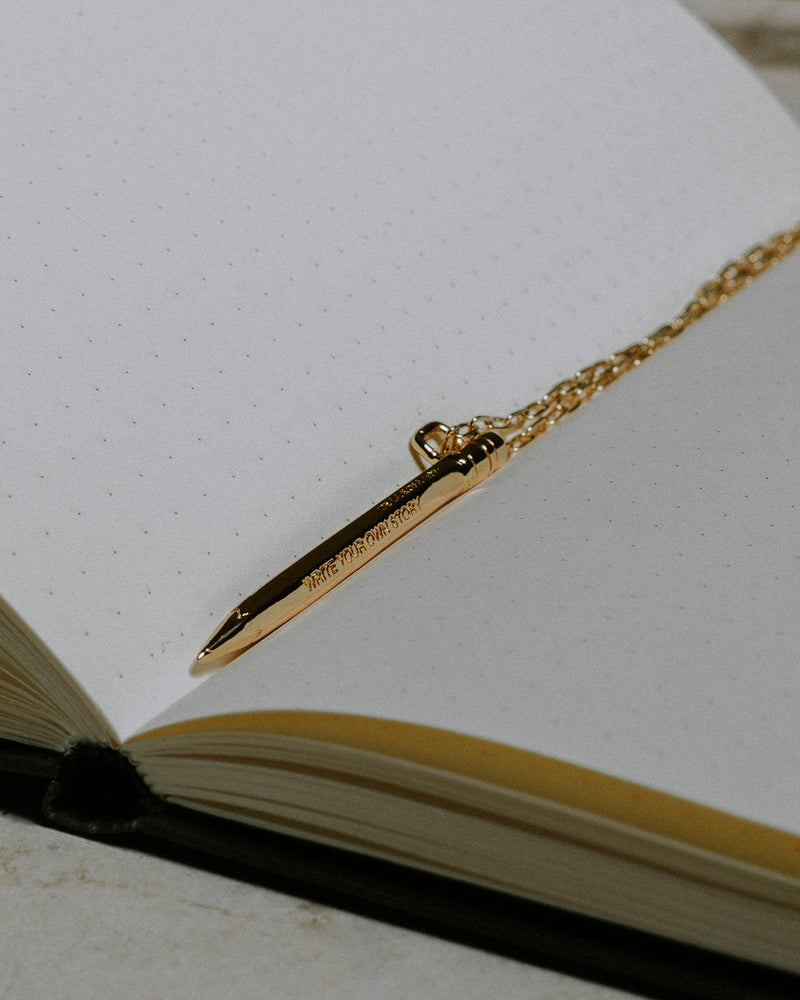 WRITE YOUR OWN STORY GOLD PENCIL PENDANT